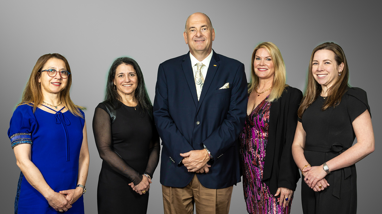 Professor Sebnem Duzgun of the Colorado School of Mines, assistant professor Nicole Smith, AGTA CEO John Ford, AGTA board president Kimberly Collins, and PhD student Jenna White.